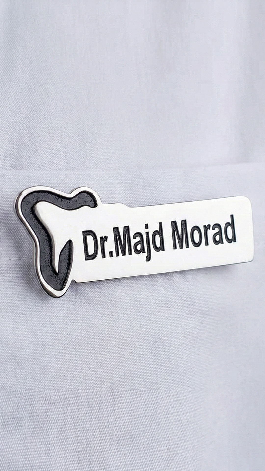 Corporate name badge close up on uniform